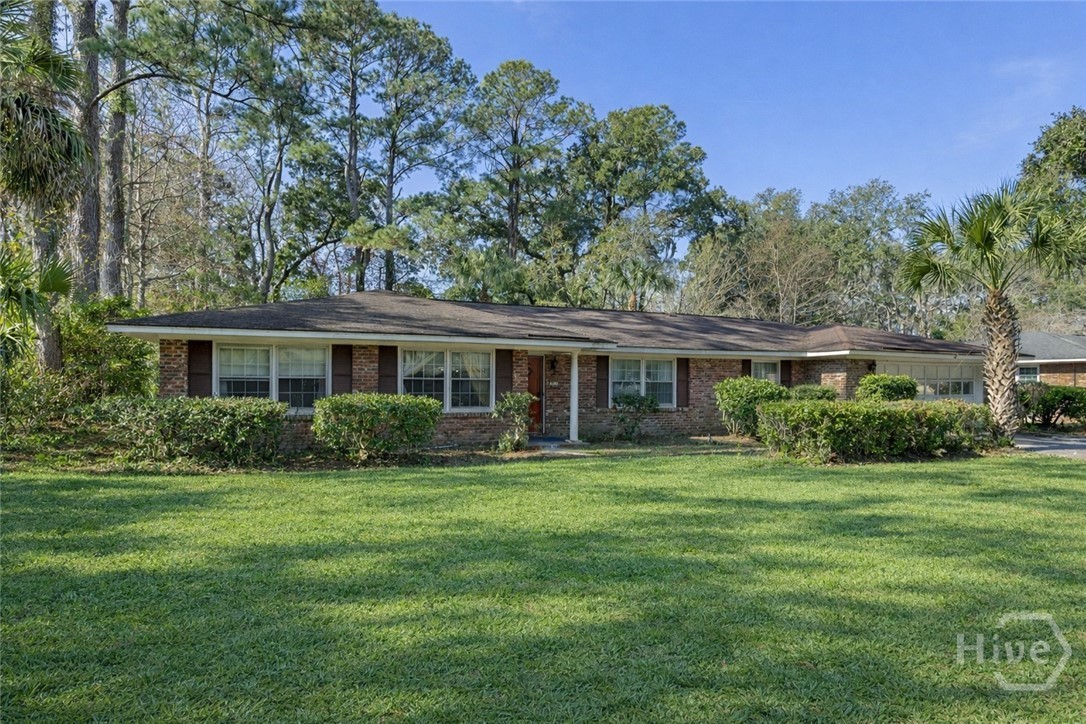 313 Wellington Road Savannah, GA 31410 - Photo 1 of 34 313 Wellington from the curb. Virtually altered landscape