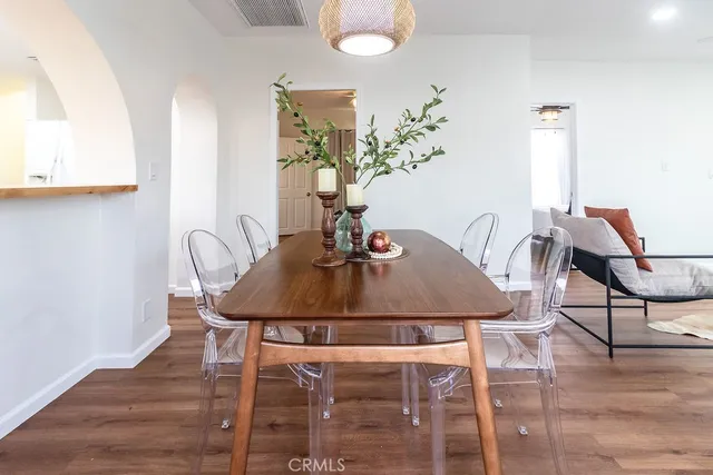 a view of a dining room with furniture and wooden floor
