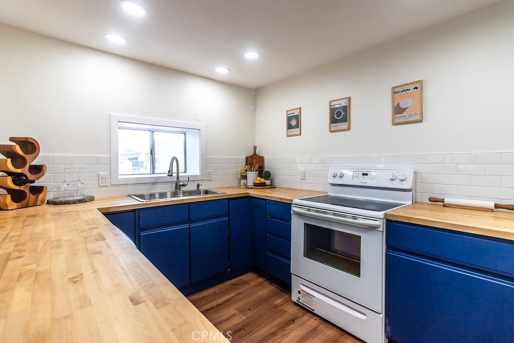 503 Palm Way Needles, CA 92363 - Photo 15 of 50 a kitchen with a stove and a sink