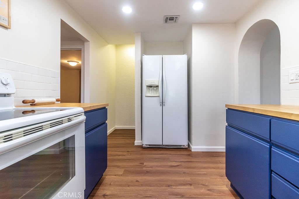 503 Palm Way Needles, CA 92363 - Photo 17 of 50 a kitchen with stainless steel appliances granite countertop a refrigerator and a stove