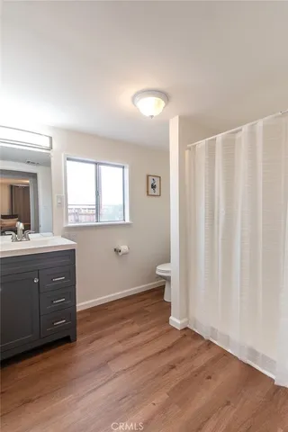 a spacious bathroom with a double vanity sink and a mirror