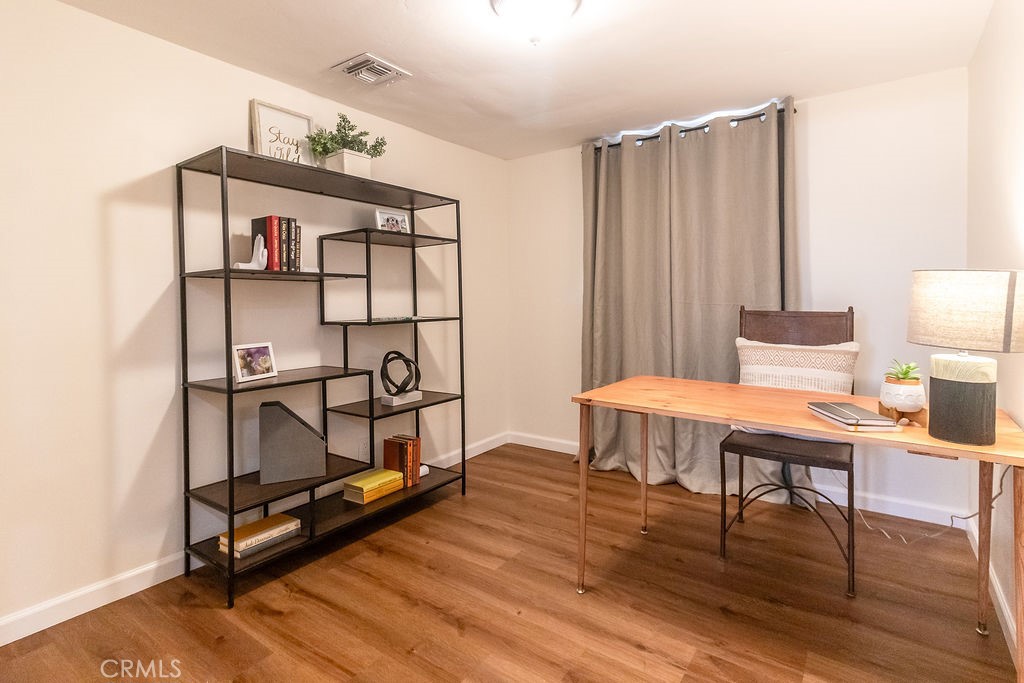 503 Palm Way Needles, CA 92363 - Photo 26 of 50 a living room with furniture a wooden floor and next to a window