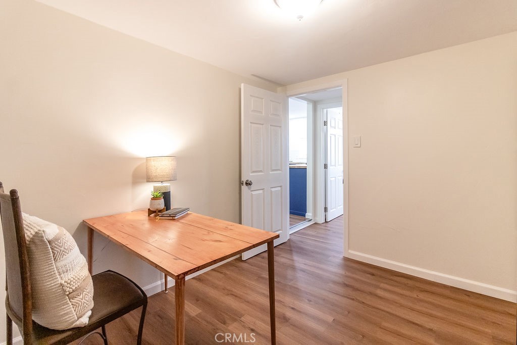 503 Palm Way Needles, CA 92363 - Photo 27 of 50 a workspace with furniture and wooden floor