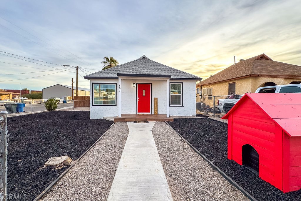 503 Palm Way Needles, CA 92363 - Photo 3 of 50 a front view of a house with a yard
