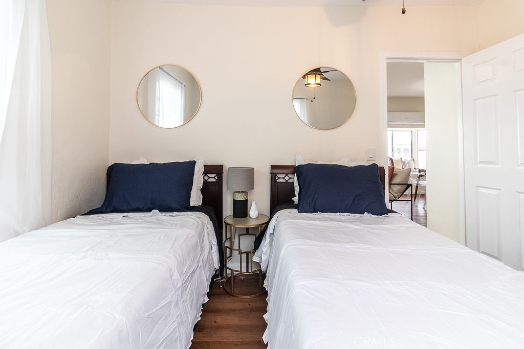 503 Palm Way Needles, CA 92363 - Photo 42 of 50 a bedroom with bed and a chandelier