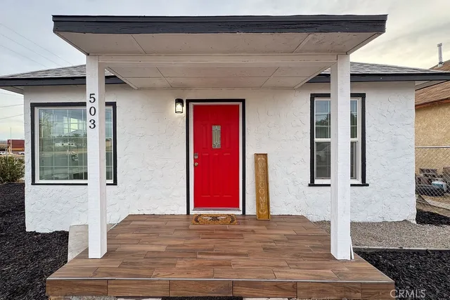 a view of a red door and chair
