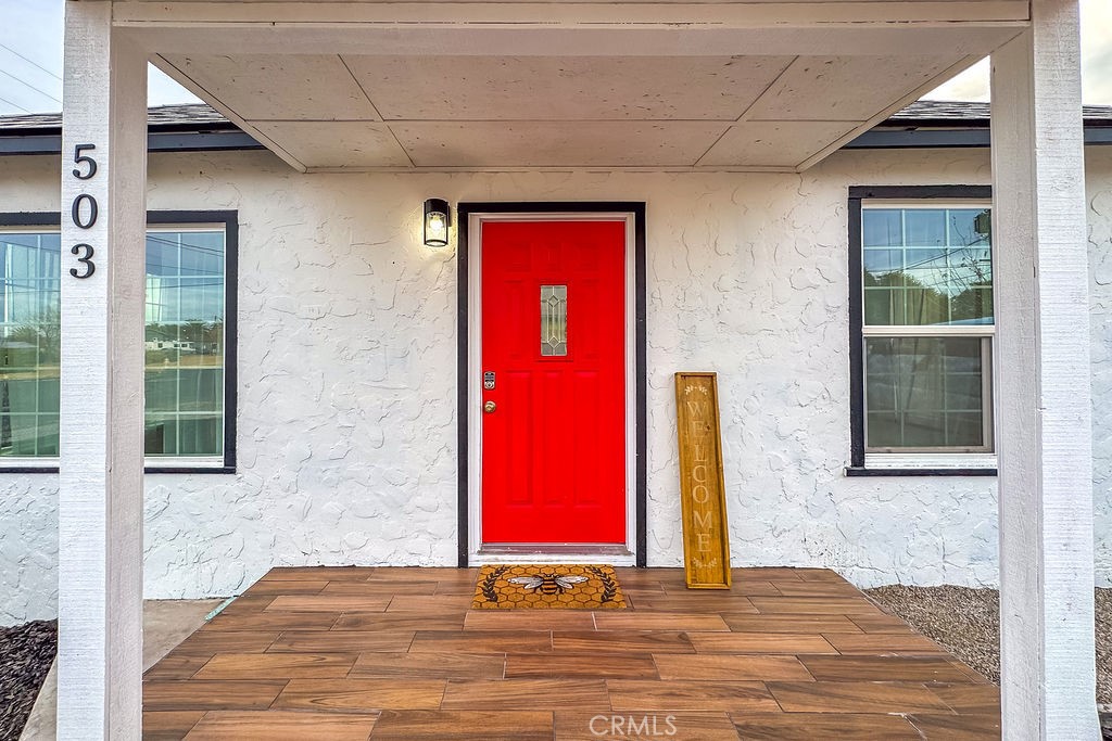 503 Palm Way Needles, CA 92363 - Photo 50 of 50 a view of a red door and chair
