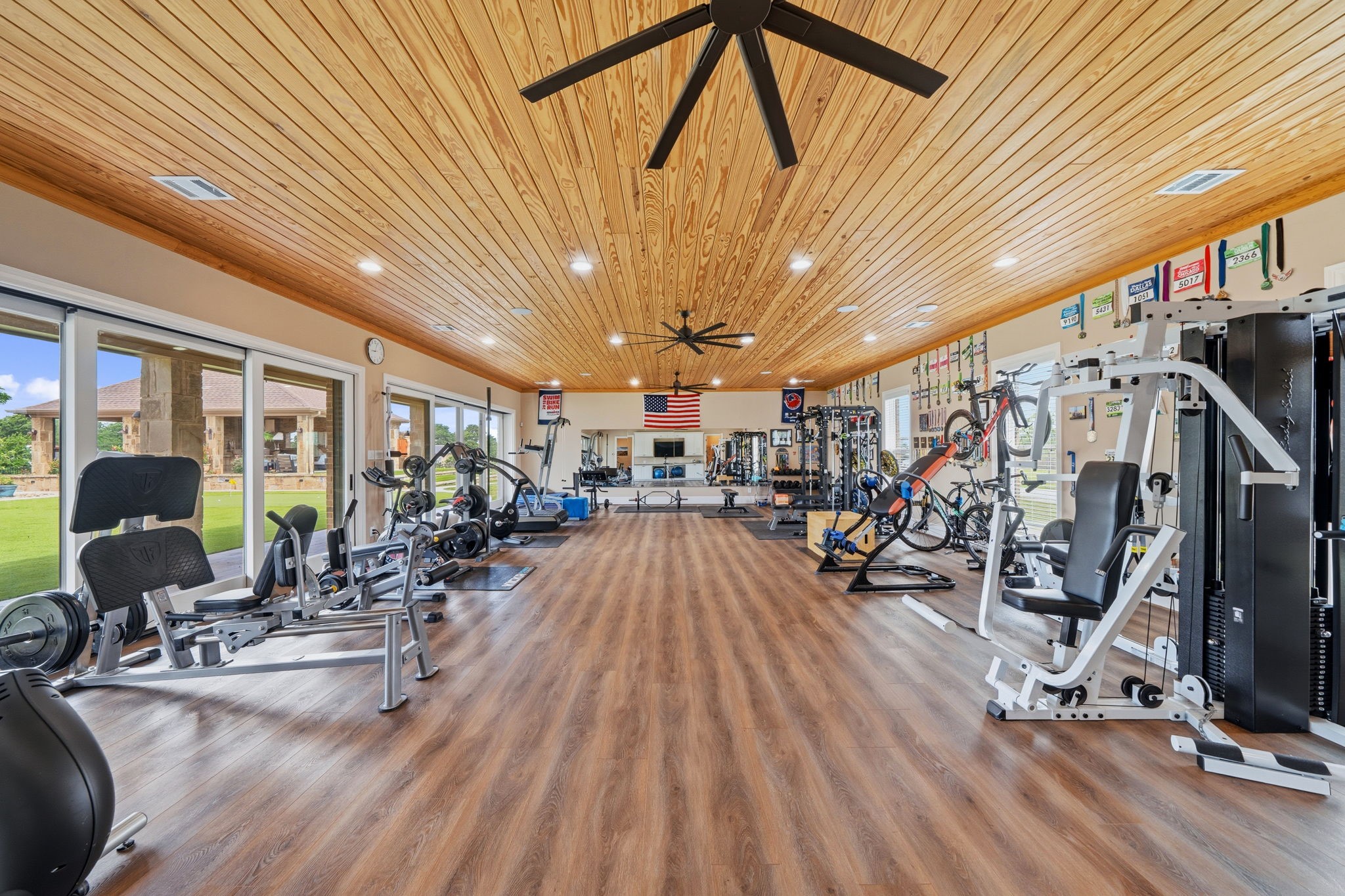 21620 Schiel Road Cypress, TX 77433 - Photo 31 of 49 This space has a wall of sliding doors overlooking the pool and putting green. The current owners use this as a gym.
The gym equipment can be purchased.