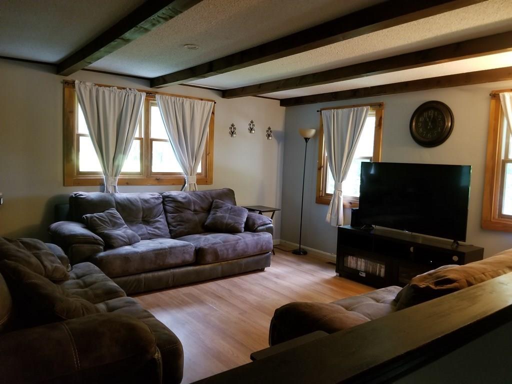 381 North Brookfield Road Barre, MA 01005 - Photo 3 of 23 a living room with furniture and a flat screen tv