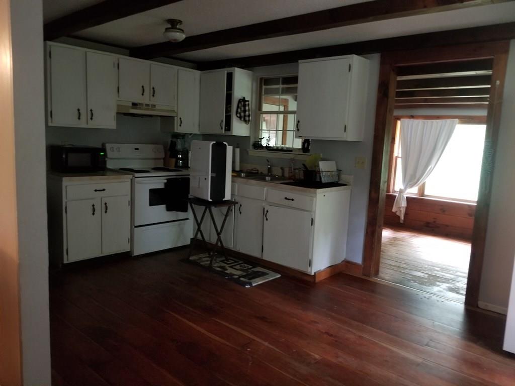 381 North Brookfield Road Barre, MA 01005 - Photo 10 of 23 a kitchen with a sink cabinets and wooden floor