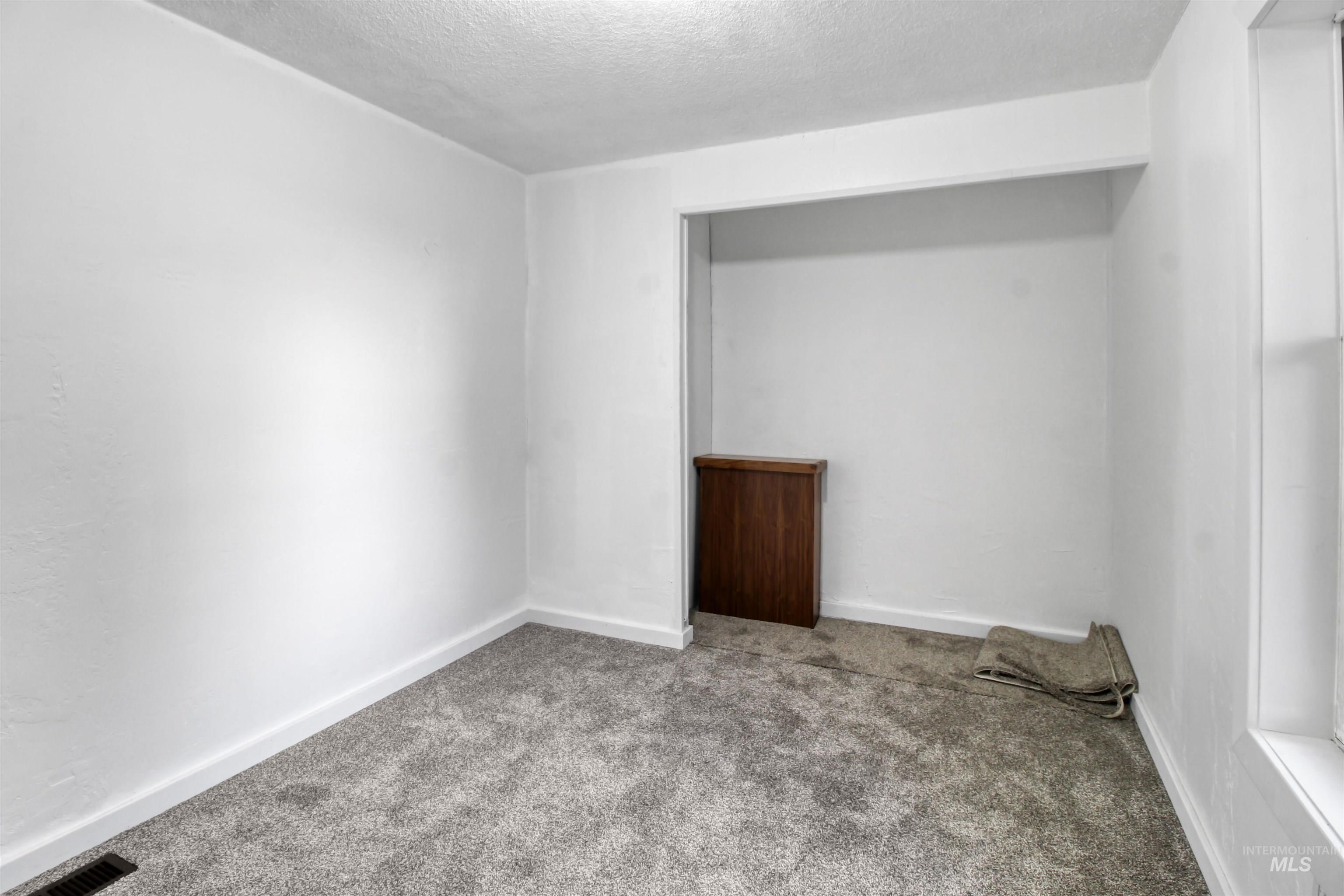 377 South 200 West, Unit 36 Rupert, ID 83350 - Photo 7 of 31 Empty room with carpet and a textured ceiling