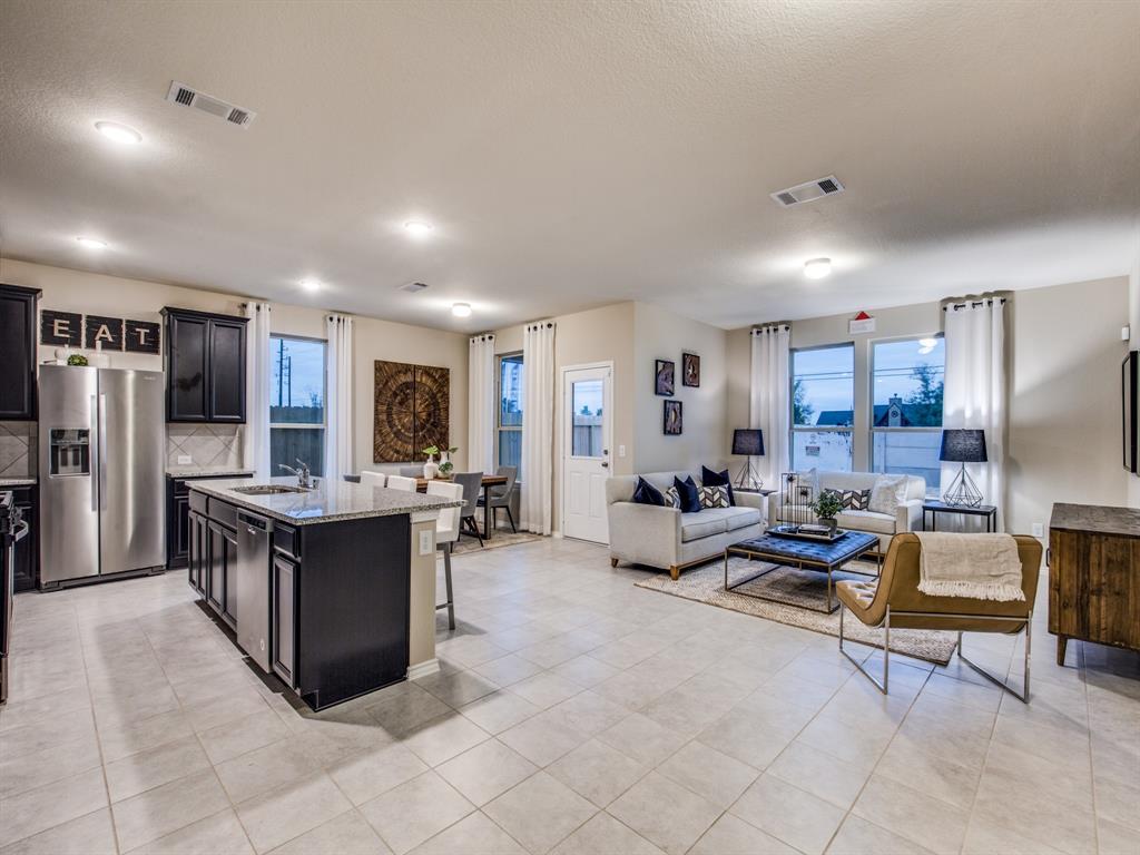16016 Isles Drive Haslet, TX 76052 - Photo 2 of 8 Large island overlooking gathering room and dining areas *Model Representation*