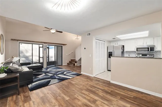 a view of a living room kitchen and a window