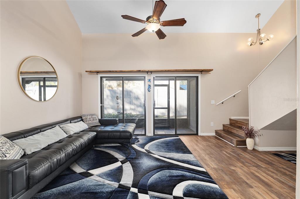 7200 Southwest 8th Avenue, Unit E29 Gainesville, FL 32607 - Photo 15 of 47 a living room with furniture and a large window