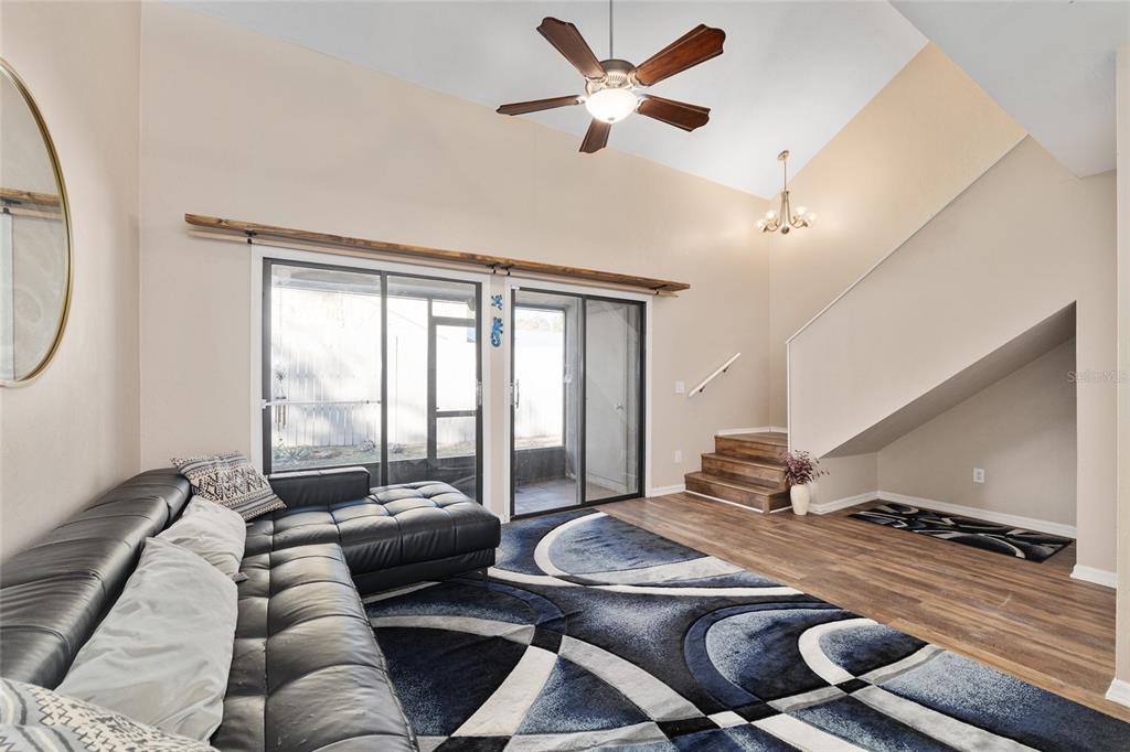 7200 Southwest 8th Avenue, Unit E29 Gainesville, FL 32607 - Photo 16 of 47 a living room with furniture and a large window