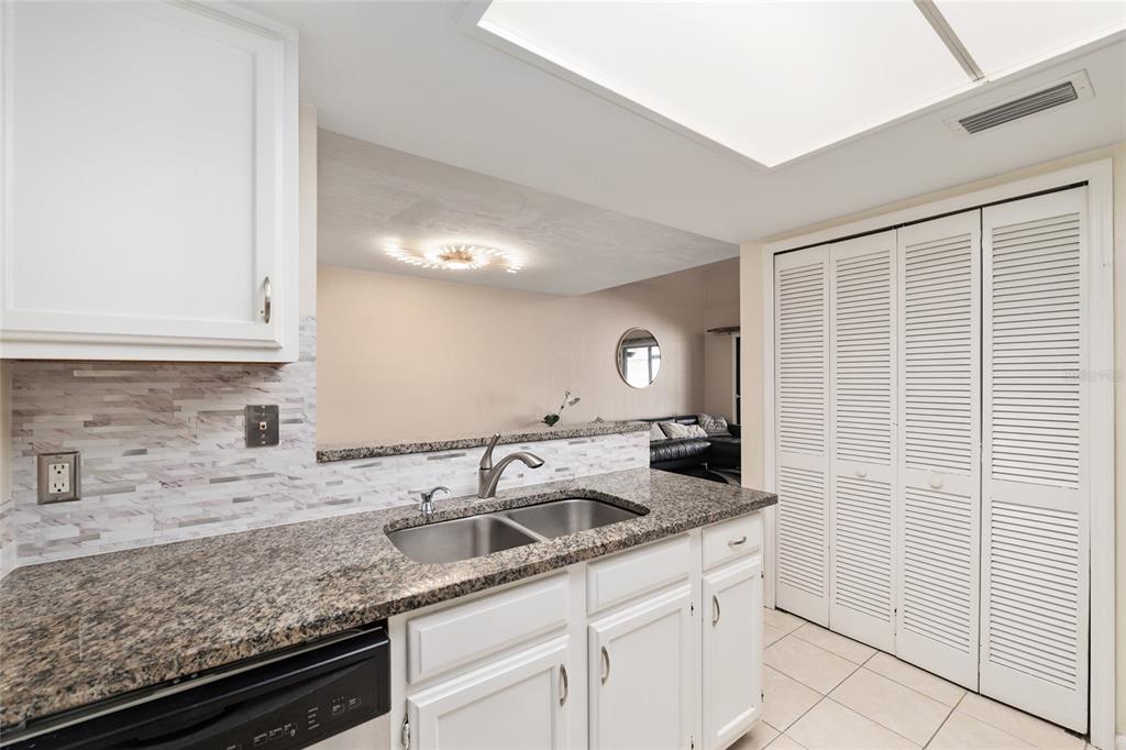 7200 Southwest 8th Avenue, Unit E29 Gainesville, FL 32607 - Photo 24 of 47 a kitchen with a sink and cabinets
