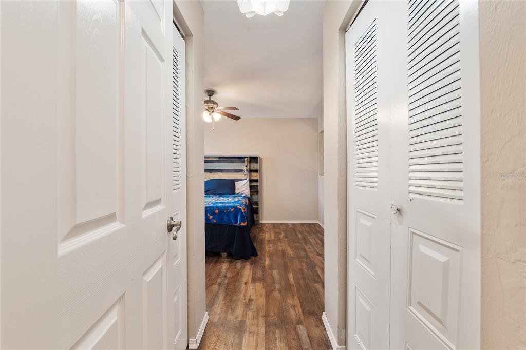 7200 Southwest 8th Avenue, Unit E29 Gainesville, FL 32607 - Photo 32 of 47 a view of a bedroom with wooden floor