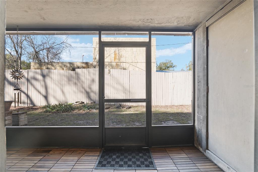 7200 Southwest 8th Avenue, Unit E29 Gainesville, FL 32607 - Photo 38 of 47 a view of empty room with wooden floor and a window