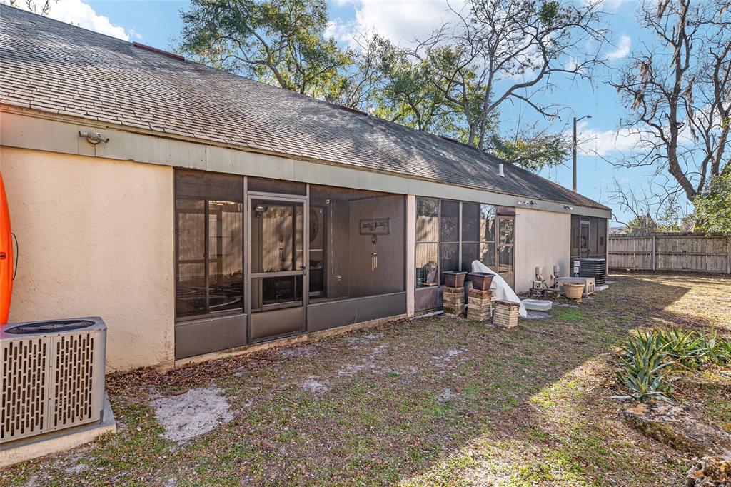 7200 Southwest 8th Avenue, Unit E29 Gainesville, FL 32607 - Photo 42 of 47 a view of a house with backyard porch and sitting area