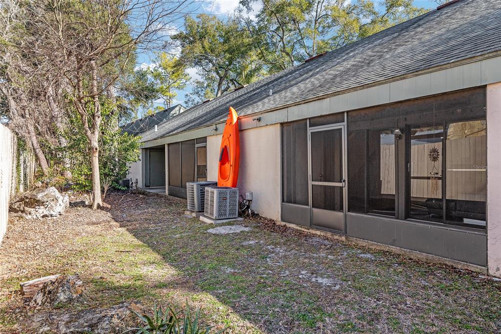 7200 Southwest 8th Avenue, Unit E29 Gainesville, FL 32607 - Photo 43 of 47 a view of a house with backyard and porch