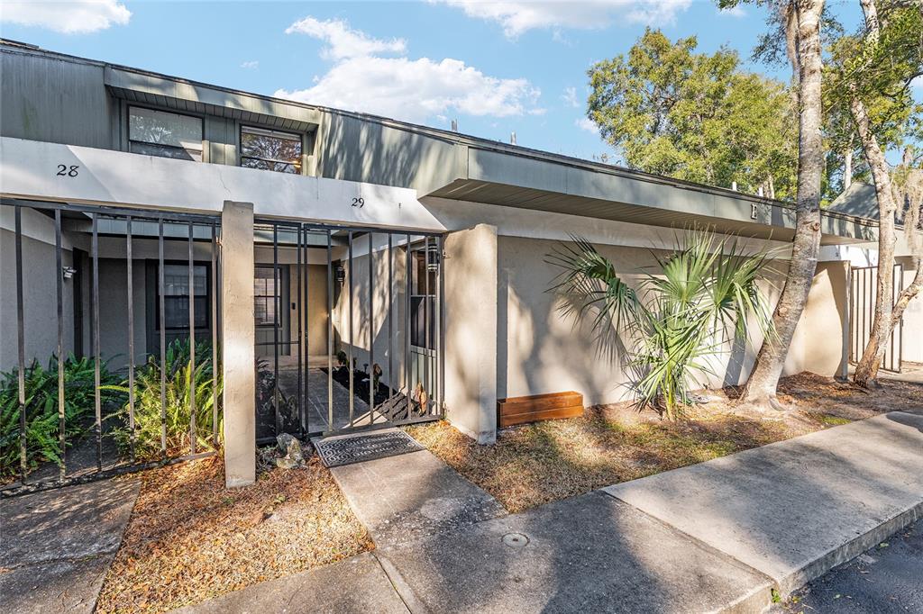 7200 Southwest 8th Avenue, Unit E29 Gainesville, FL 32607 - Photo 6 of 47 a view of a house with a outdoor space