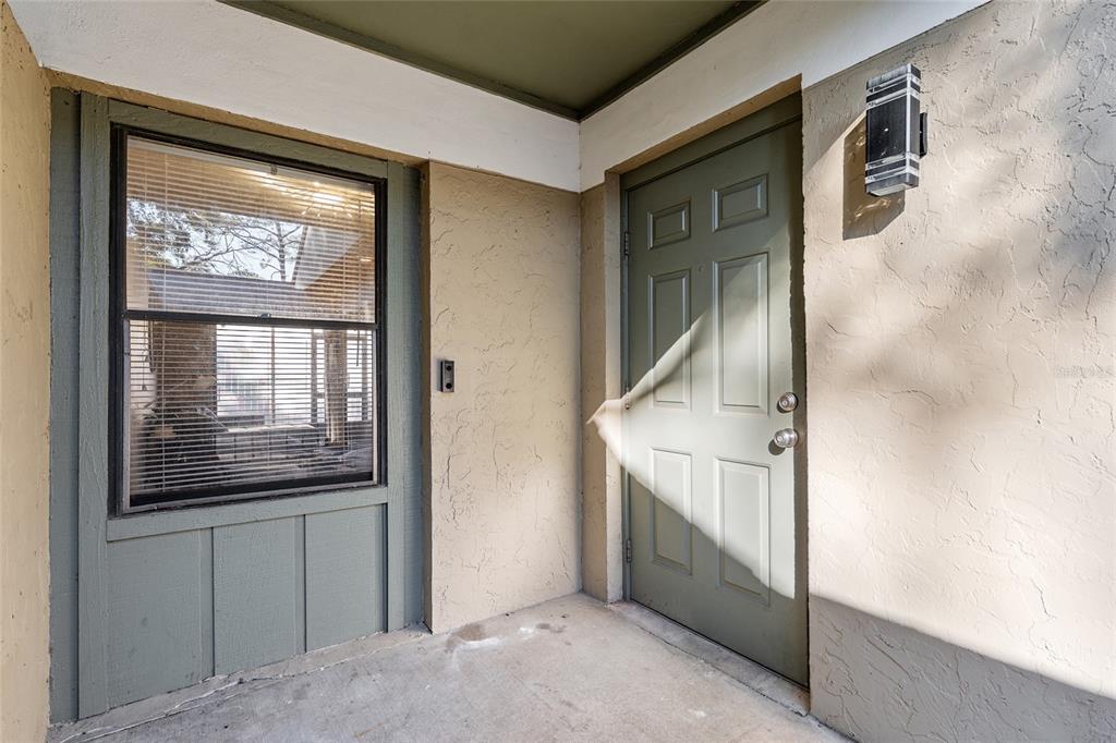 7200 Southwest 8th Avenue, Unit E29 Gainesville, FL 32607 - Photo 10 of 47 a view of a hallway with windows
