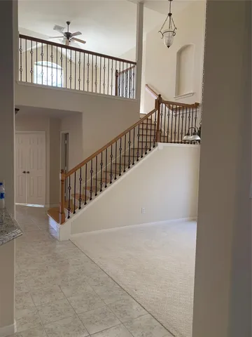 a kitchen with a stove sink and cabinets