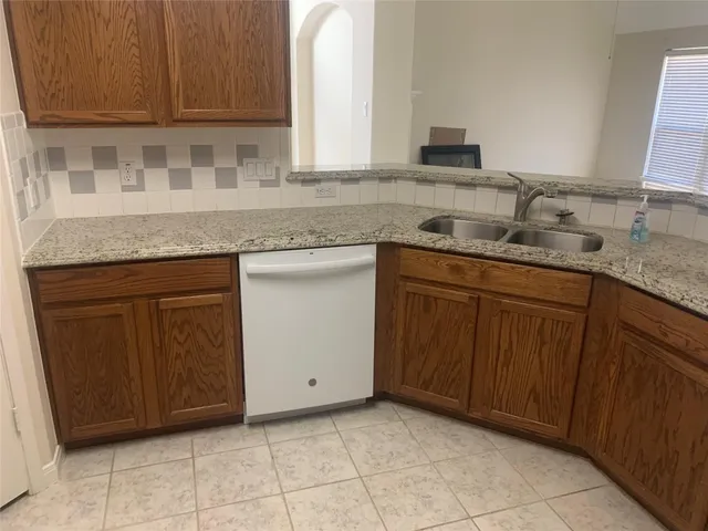 a view of a bathroom with a sink a mirror and vanity