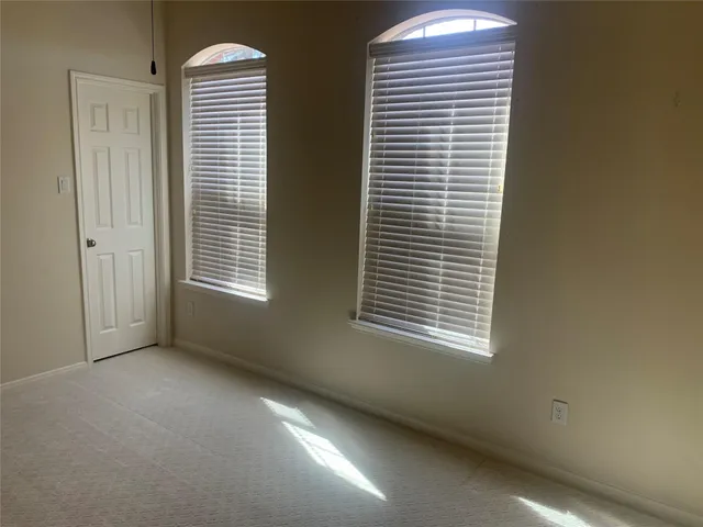 a kitchen with granite countertop a stove top oven microwave and cabinets