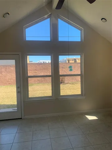 a kitchen with wooden cabinets and a stove top oven