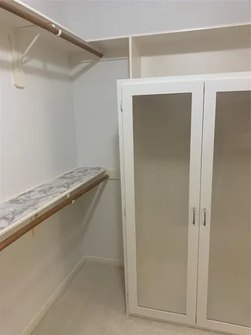 a bathroom with a bathtub and a window