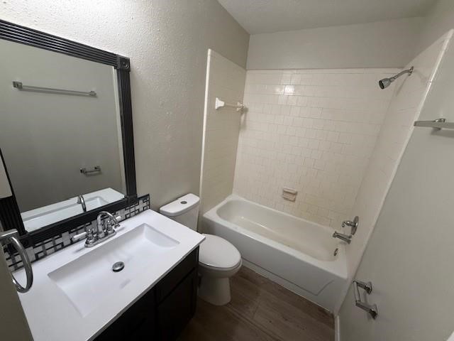 22211 Moss Falls Lane Spring, TX 77373 - Photo 9 of 12 a bathroom with a bathtub shower sink vanity mirror and toilet