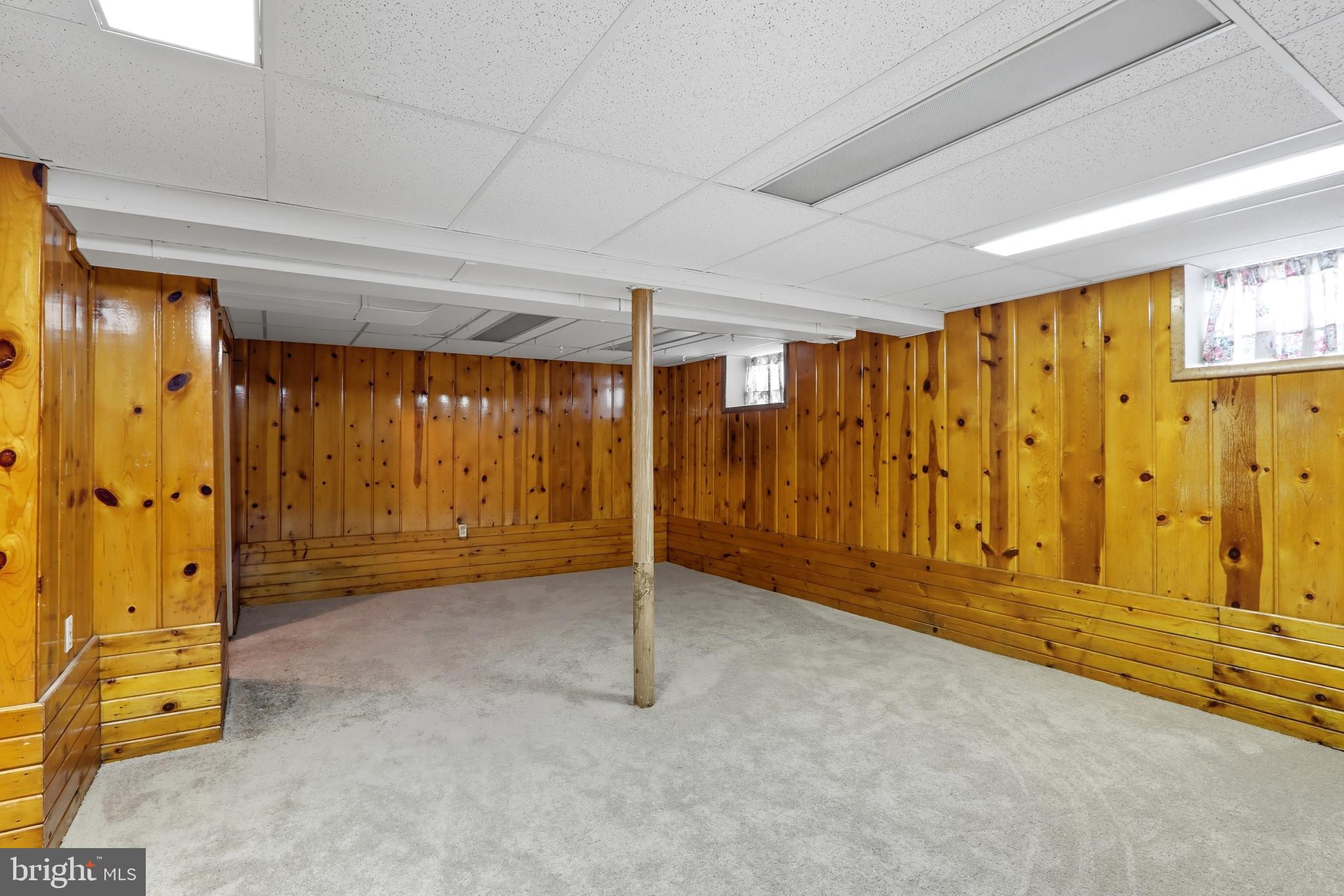 60 South Ritters Lane Owings Mills, MD 21117 - Photo 20 of 31 Spacious basement with warm wood accents.