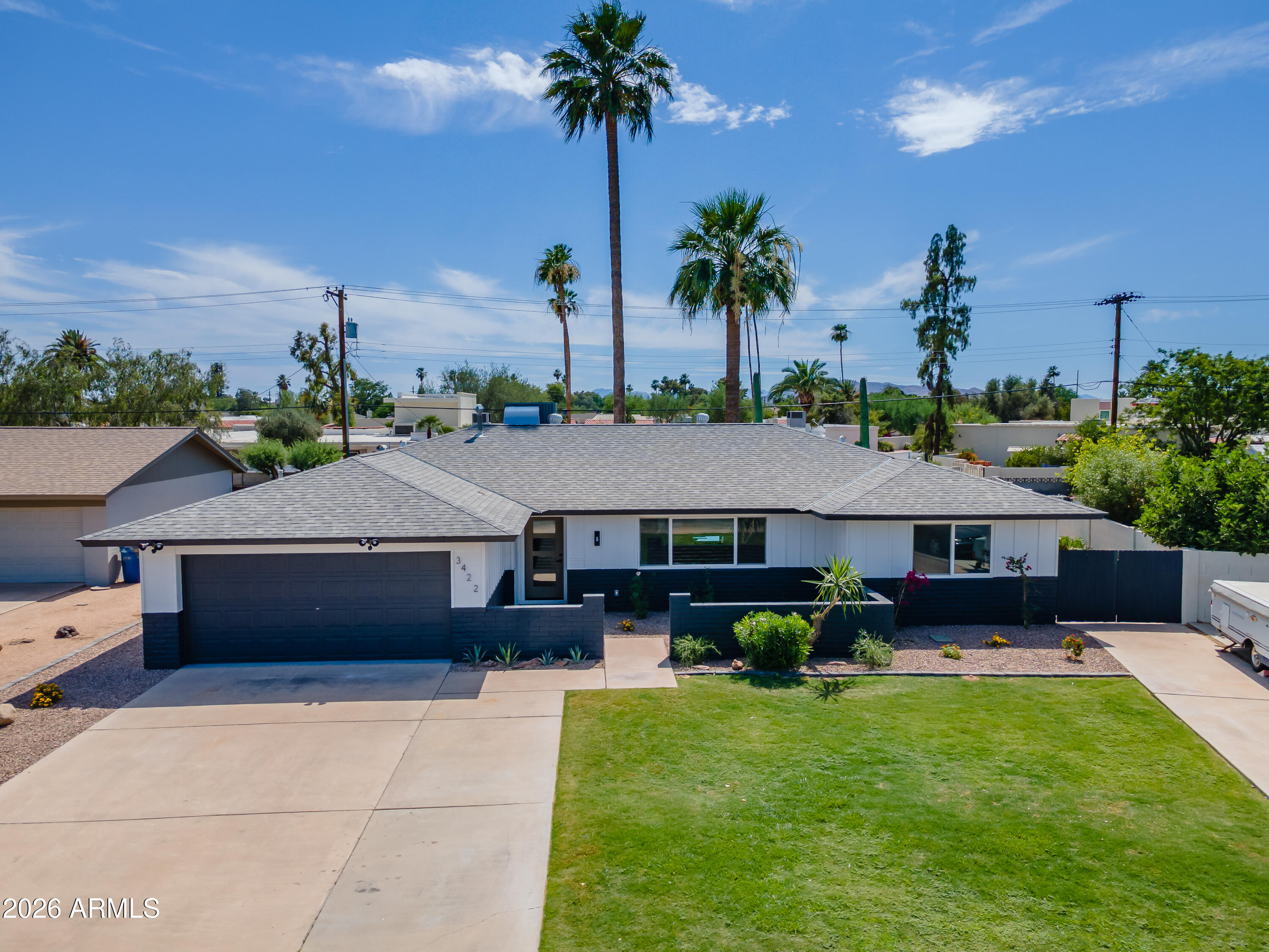 3422 South Terrace Road Tempe, AZ 85282 - Photo 38 of 43 a front view of a house with garden