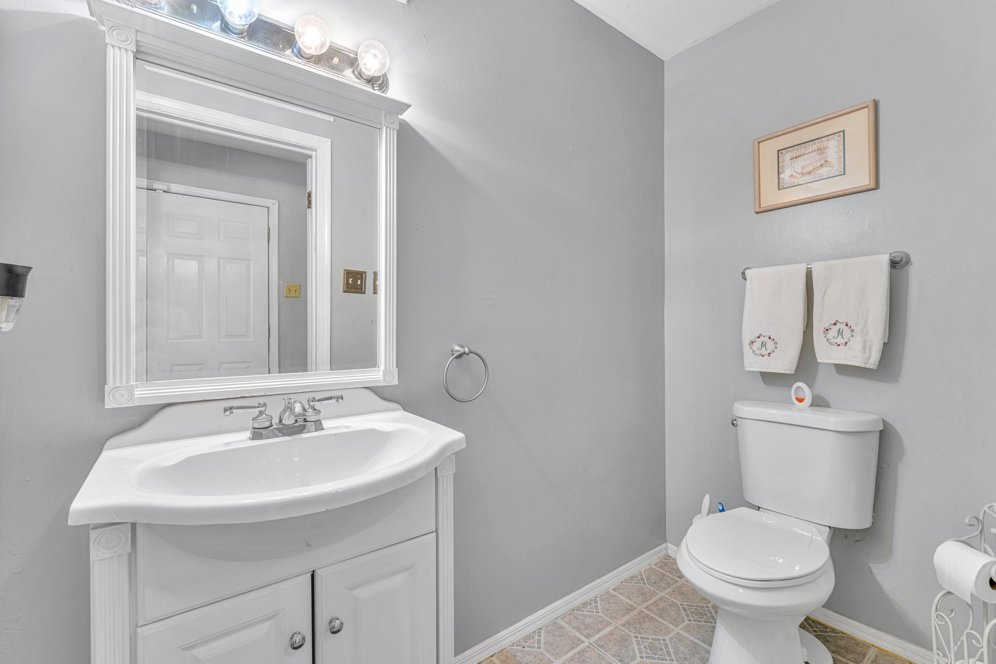 4 Barbara Place Somerdale, NJ 08083 - Photo 15 of 36 a bathroom with a toilet a sink and mirror