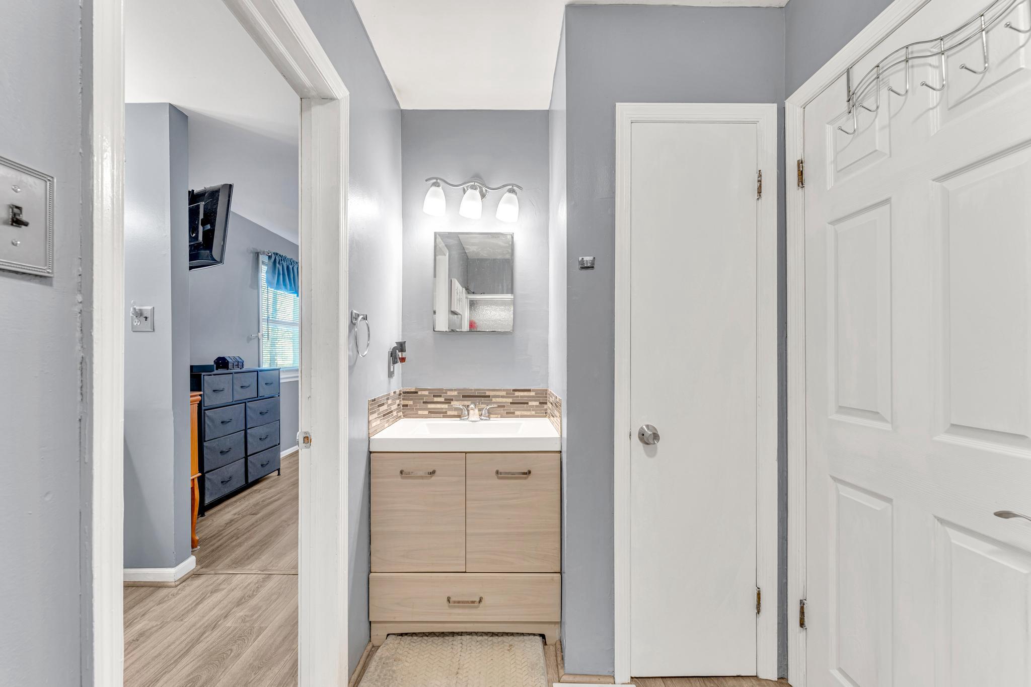 4 Barbara Place Somerdale, NJ 08083 - Photo 24 of 36 a bathroom with a granite countertop sink and a mirror