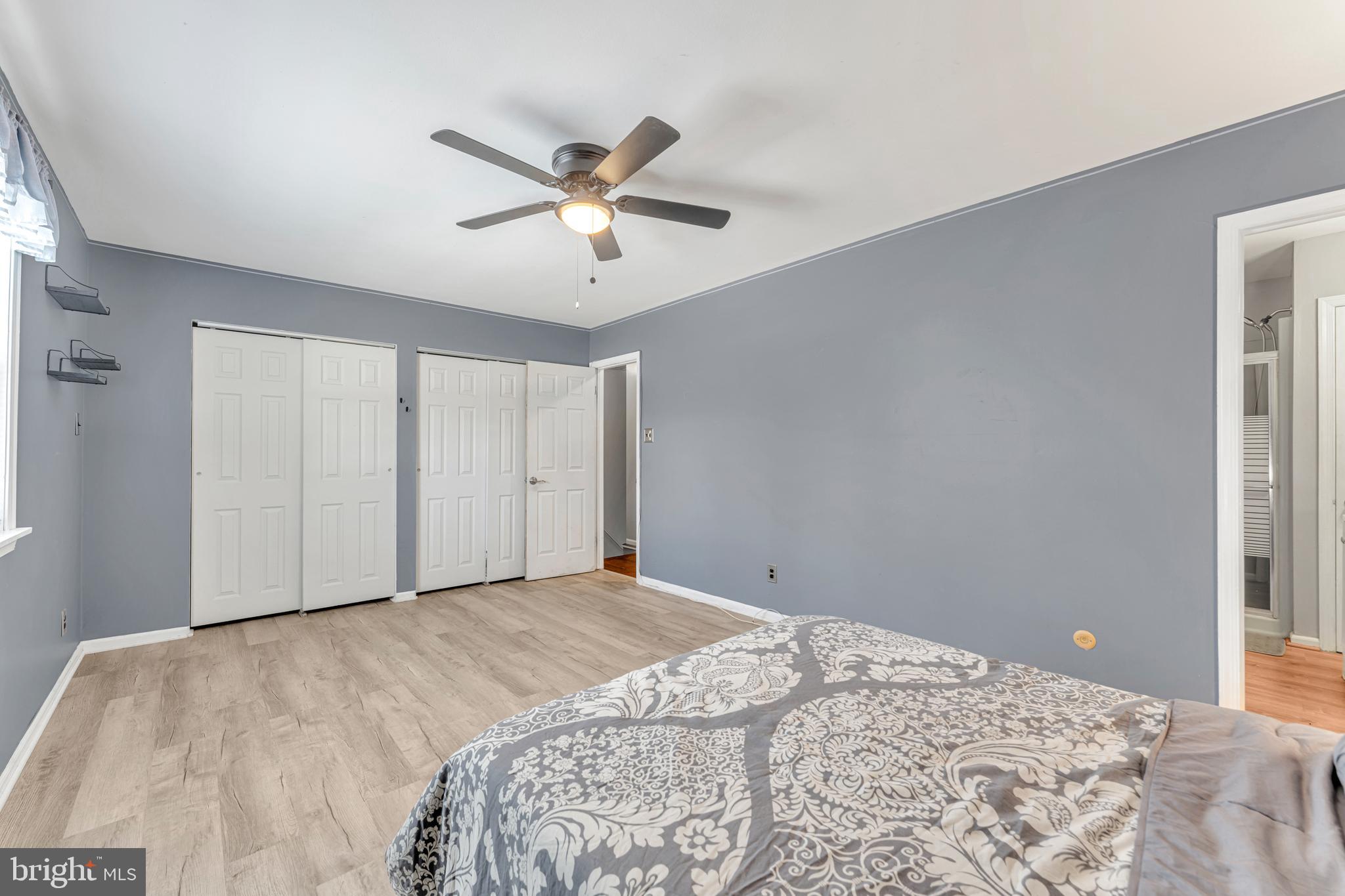 4 Barbara Place Somerdale, NJ 08083 - Photo 27 of 36 a bedroom with a large bed and a chandelier