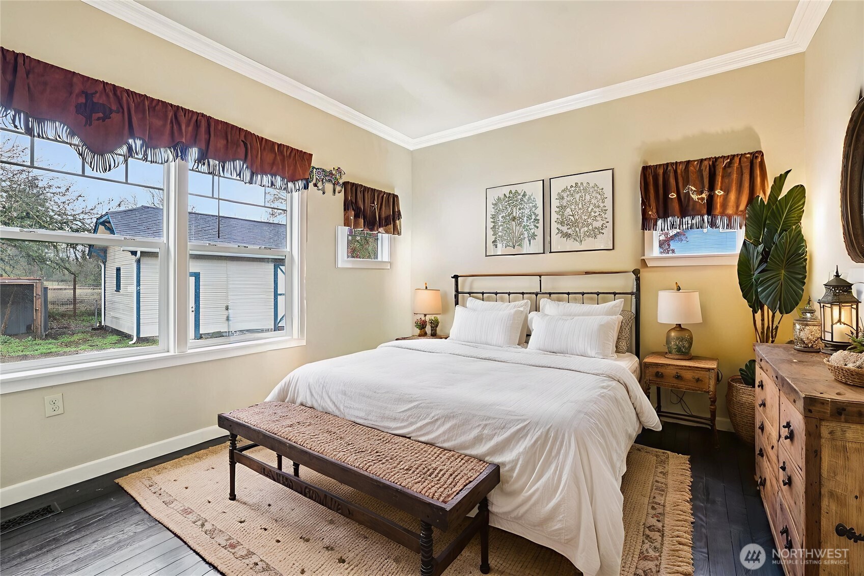 537 McNaught Road South Roy, WA 98580 - Photo 11 of 32 a bedroom with a bed and wooden floor