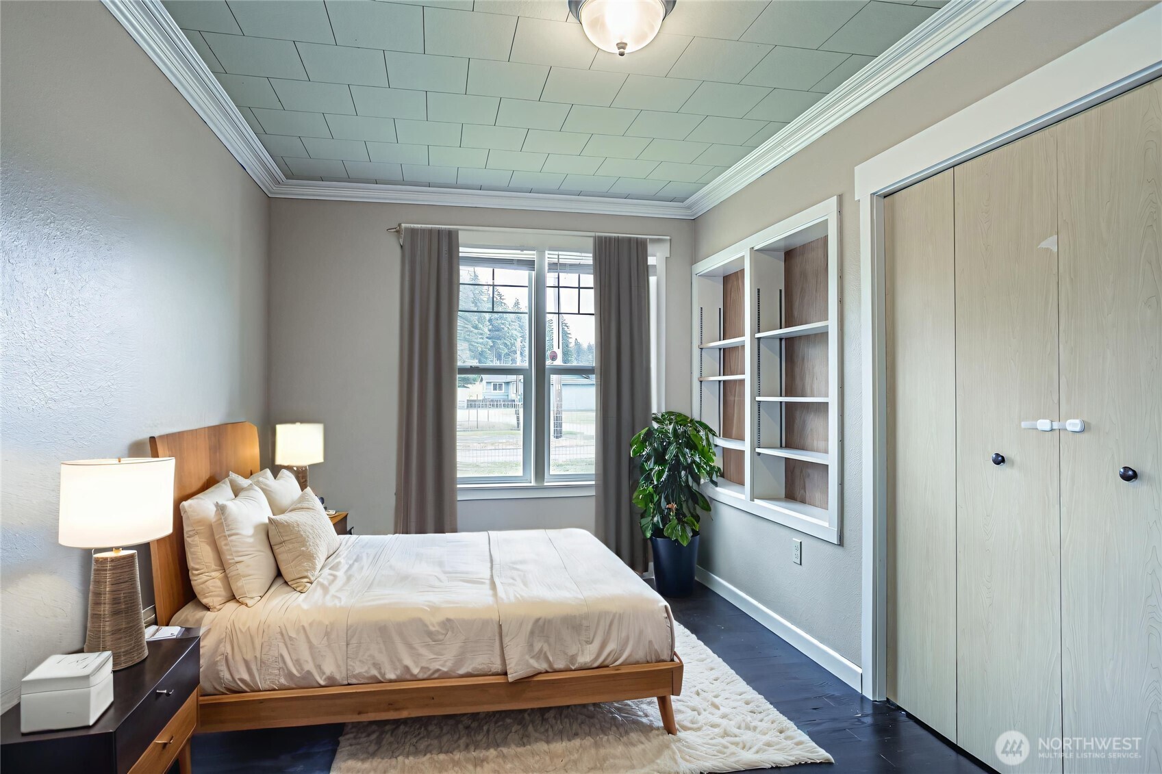 537 McNaught Road South Roy, WA 98580 - Photo 12 of 32 a bedroom with a large bed and a window