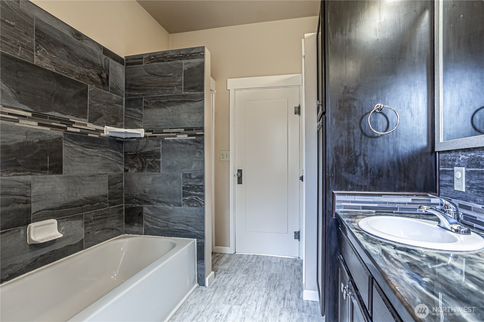537 McNaught Road South Roy, WA 98580 - Photo 15 of 32 a bathroom with a granite countertop sink toilet and shower