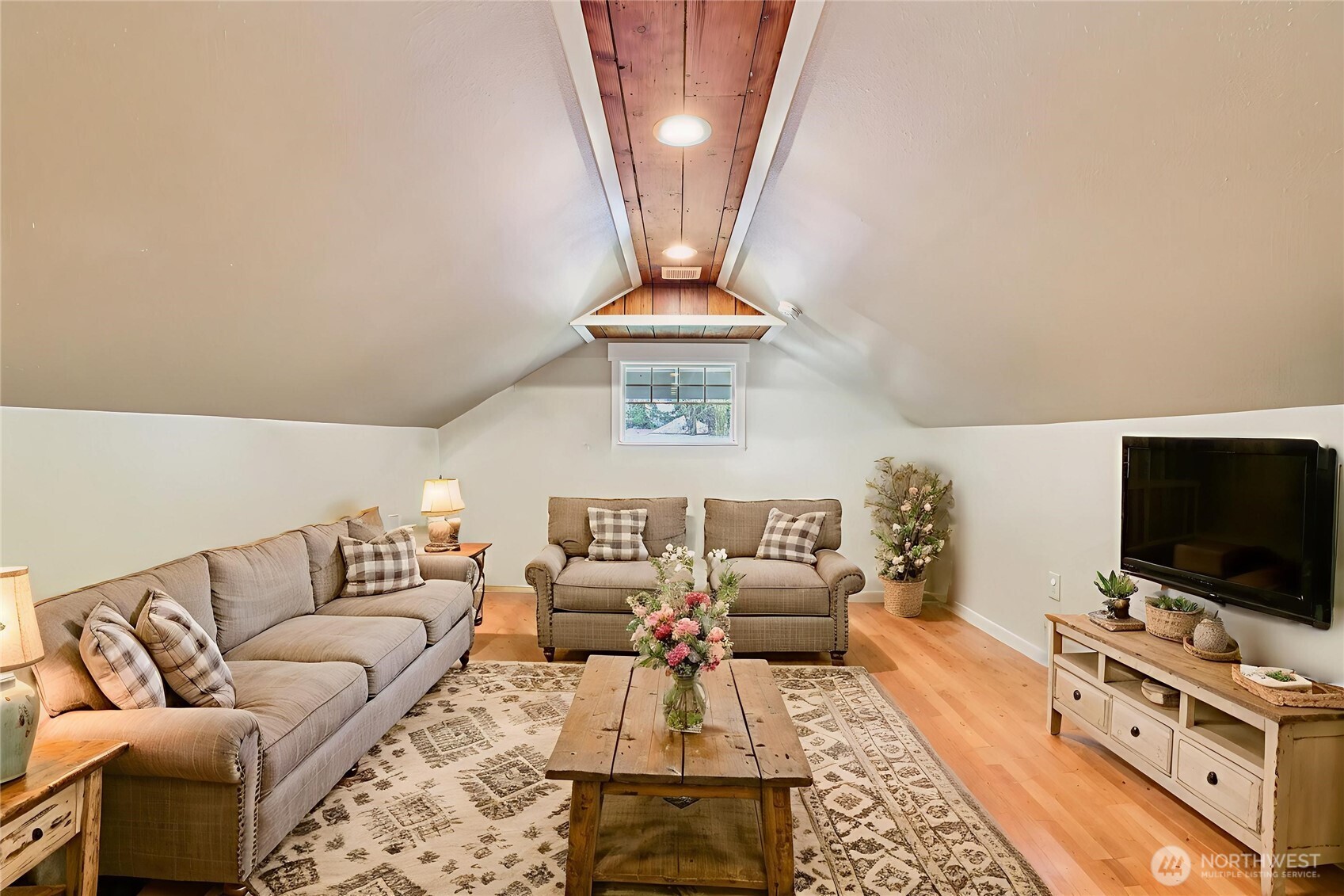 537 McNaught Road South Roy, WA 98580 - Photo 17 of 32 a living room with furniture and a flat screen tv