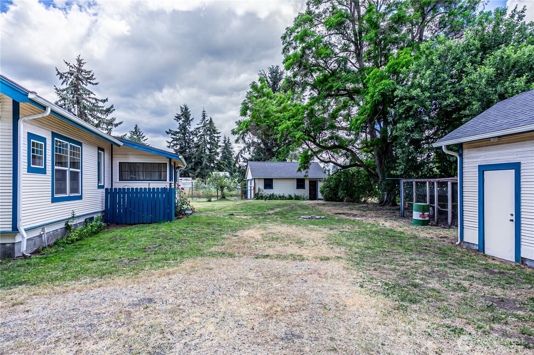 537 McNaught Road South Roy, WA 98580 - Photo 29 of 32 a view of a house with backyard and trees
