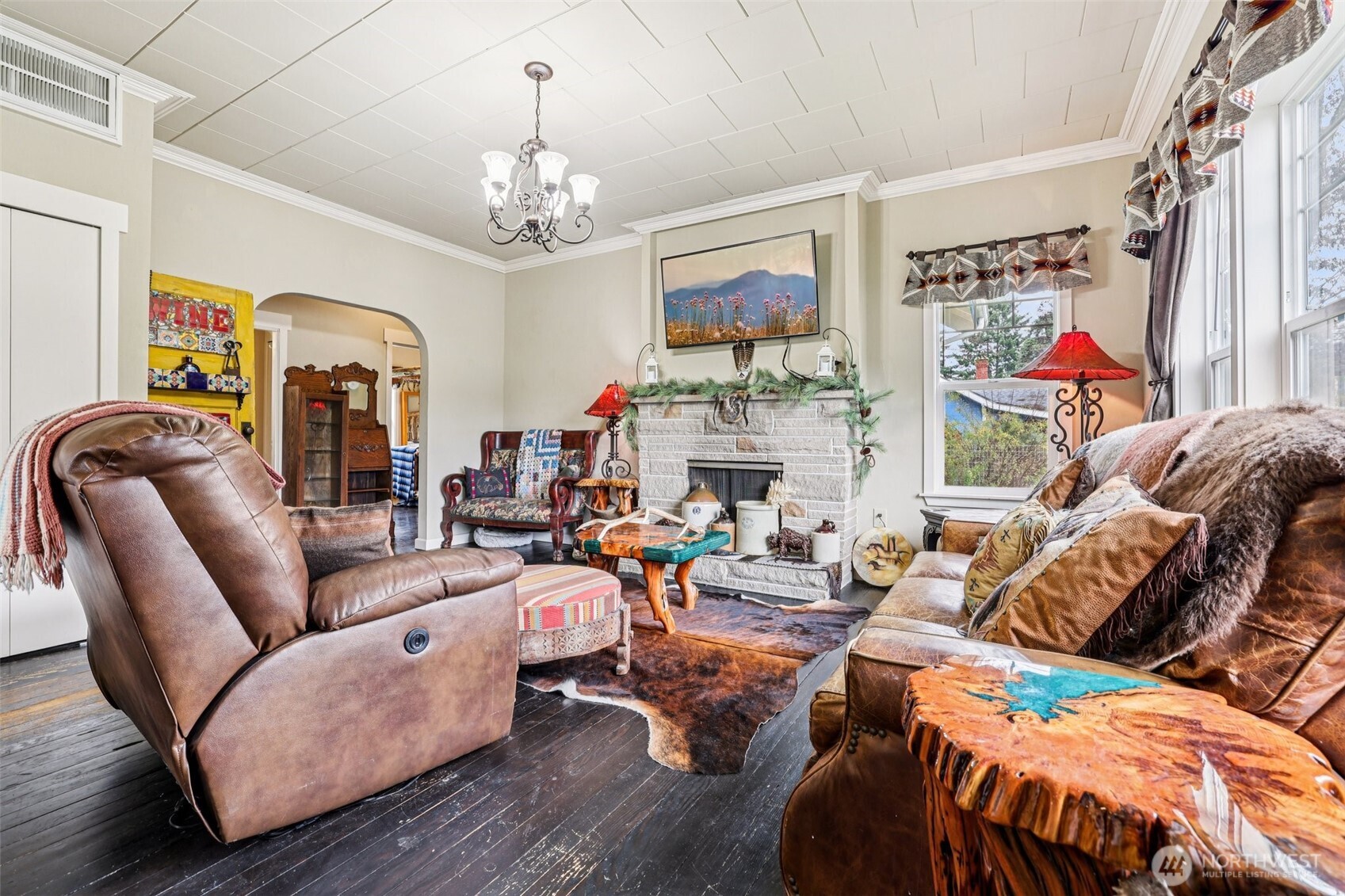 537 McNaught Road South Roy, WA 98580 - Photo 5 of 32 a living room with furniture a fireplace and a chandelier