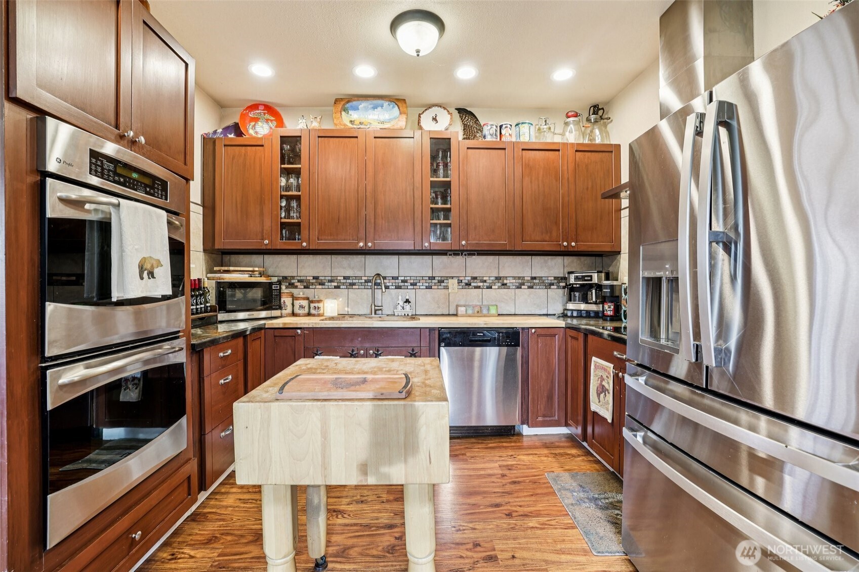 537 McNaught Road South Roy, WA 98580 - Photo 7 of 32 a kitchen with stainless steel appliances granite countertop a refrigerator and a stove