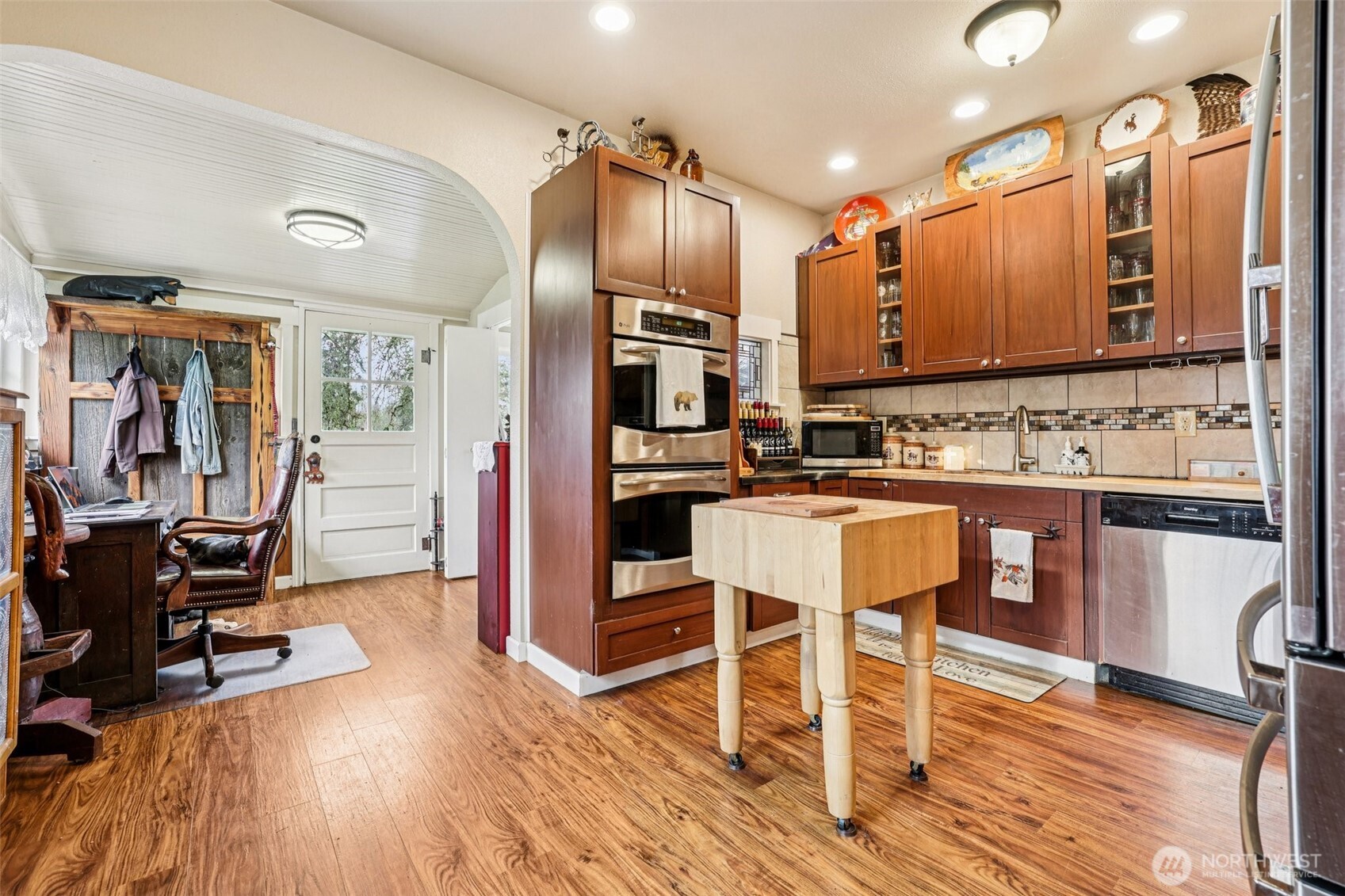537 McNaught Road South Roy, WA 98580 - Photo 9 of 32 a kitchen with stainless steel appliances kitchen island granite countertop wooden floors and a view of living room