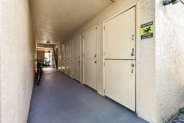 a sign that is on a pole on a street