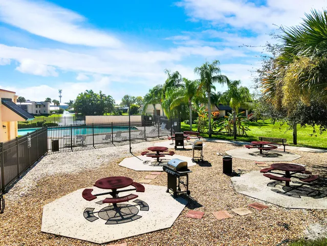 a playing room with furniture and wooden floor