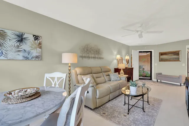 a living room with furniture and a table