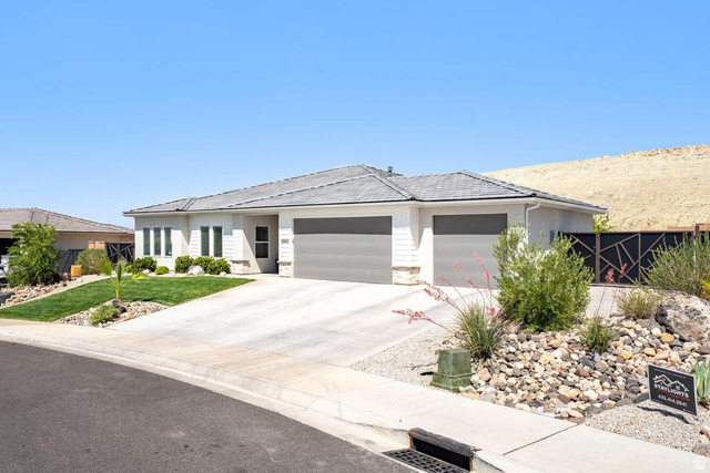 5963 Flattop Drive St. George, UT 84790 - Photo 2 of 45 Modern stucco exterior with a gray shingle roof, twin two-car garages, and a concrete driveway