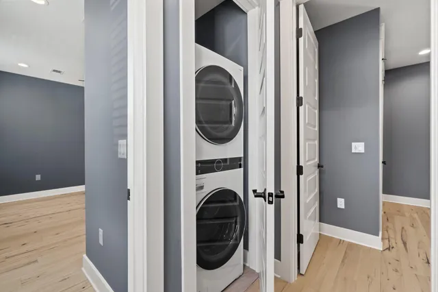 a view of a hallway with washer and dryer